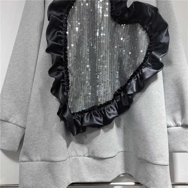 Pre Order:  Heart-Shaped Sequin Splicing Loose Long Sleeved Sweater